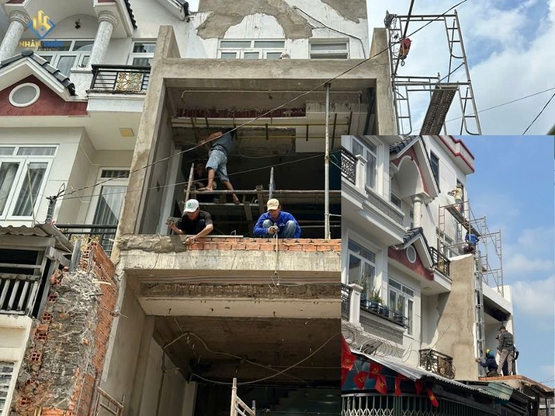 những người thợ đang sơn mặt tiền